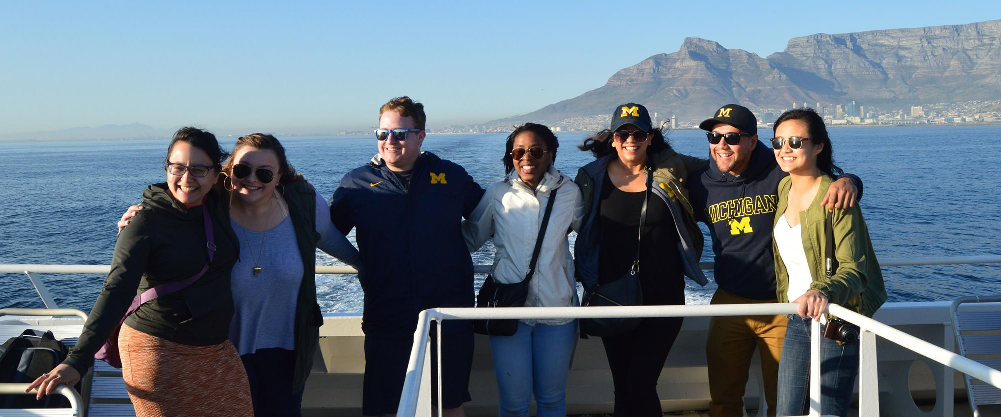 2017 CSHPE study trip group on a boat off the coast of Cape Town, South Africa