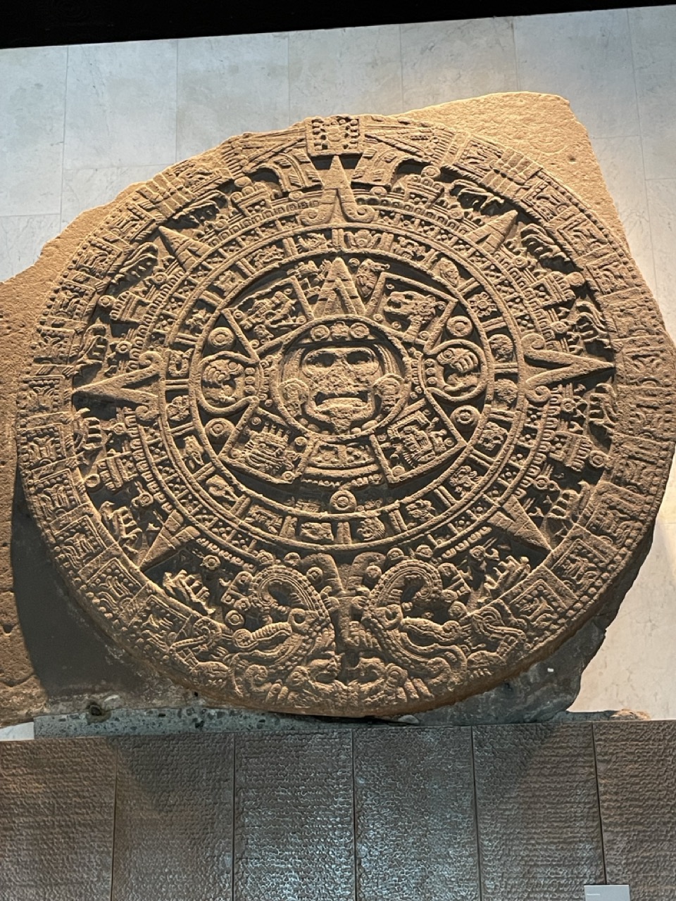 This is an original “Aztec calendar” which is housed in the Mexican Museum of Anthropology. It is a rock formation with intricate design work in a stylized sun.