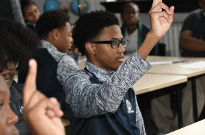 Marygrove student raising his hand on the first day of school 2019 Marygrove student raising his hand on the first day of school 2019
