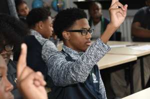 Marygrove student raising his hand on the first day of school 2019