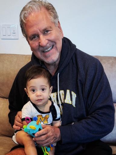 Dave Pribich poses with a toddler