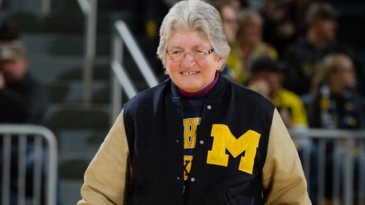 Alumna Sheryl Szady wears a U-M varsity jacket