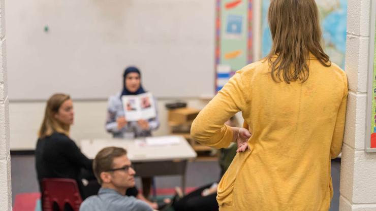 A teacher mentoring interns