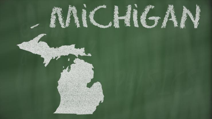 The state outline of Michigan on a chalkboard