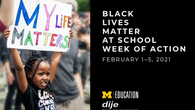 Young child of color standing with a crowd of people and holding a sign above their head that reads "My Life Matters"