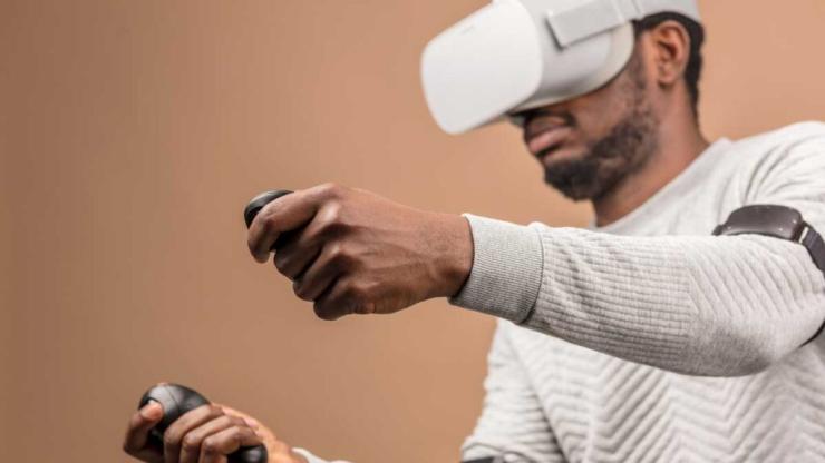 Student using VR headset in classroom.