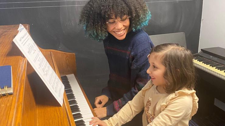 Chelcey Daniels and one of her piano students.