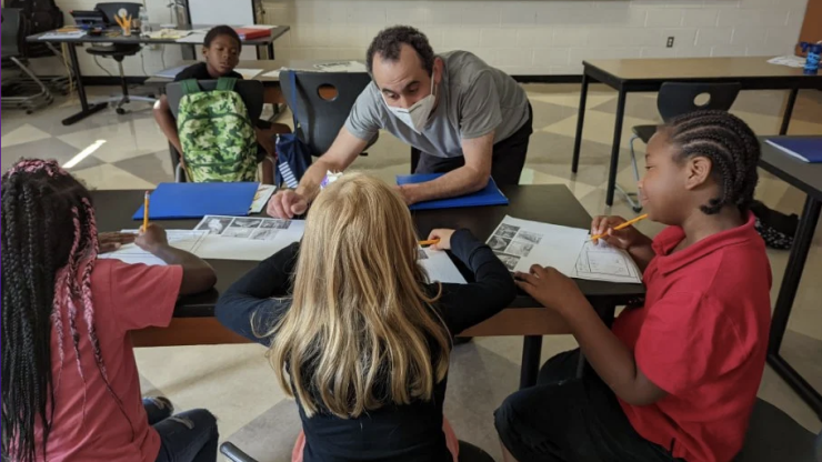 David Adler in the classroom with elementary school students.