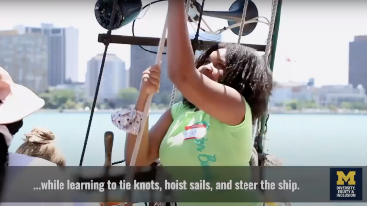 Screenshot of girl hoisting sail in Detroit River Story Lab video 
