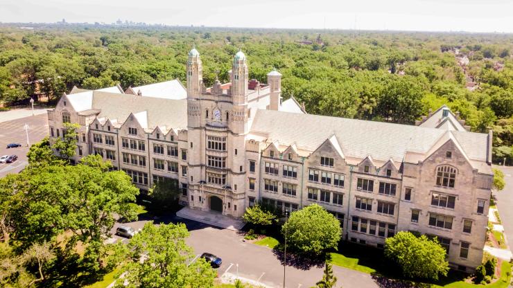 Aerial view of Marygrove Liberal Arts building, surrounded by green trees