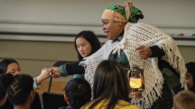 Storyteller interacting with children participants at the MLK Children and Youth Program