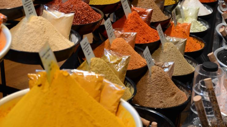 Multicolored spices for sale in an open air market