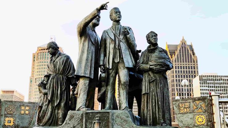 Detroit's "Gateway to Freedom" statue, showing African-American freedom seekers looking across the Detroit River to Canada.