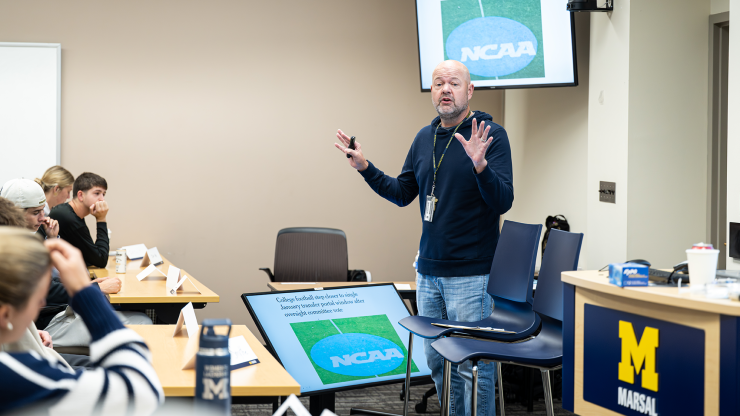 Greg Dooley speaks to students in his class “NIL: Education and Equity in Name, Image, and Likeness”