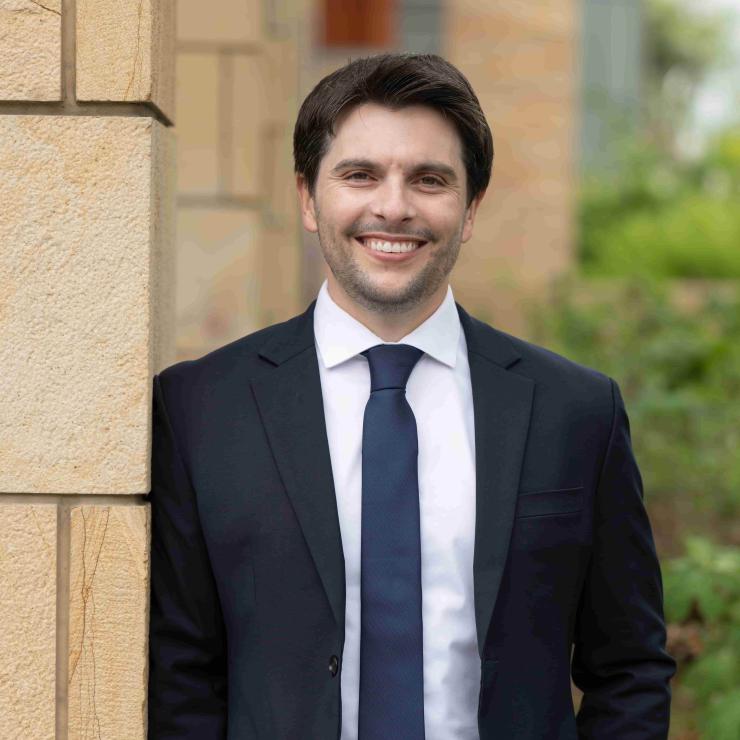 Alex Bercu stands and smiles