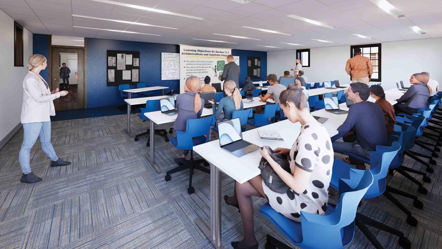 Rendering of a classroom with grey carpet, white walls with one blue accent wall, and tiled ceilings with fluorescent lighting. Students are seated in blue, plastic spinning chairs at long, skinny, white tables, facing the instructor. The instructor points to a large, digital screen behind him.