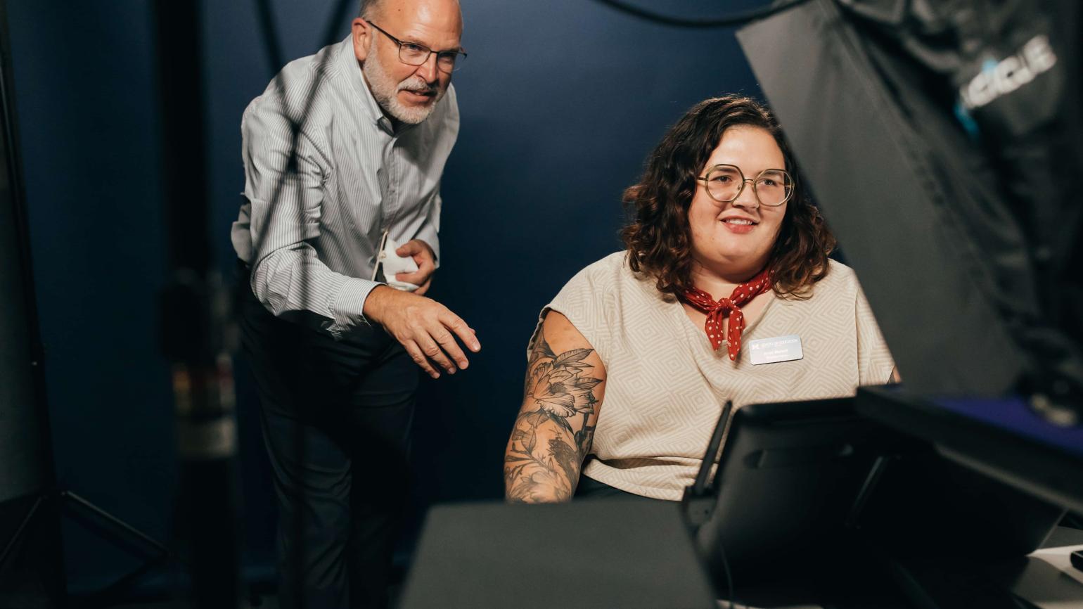 Professor Don Peurach inspects Design Lab equipment with EdHub staff