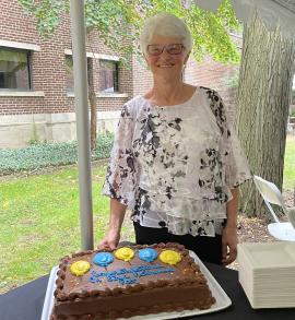 Patricia King presiding over the cake at her retirement party.