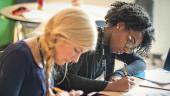 Undergraduate Elementary Education students writing notes