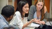 Student talks while others look on